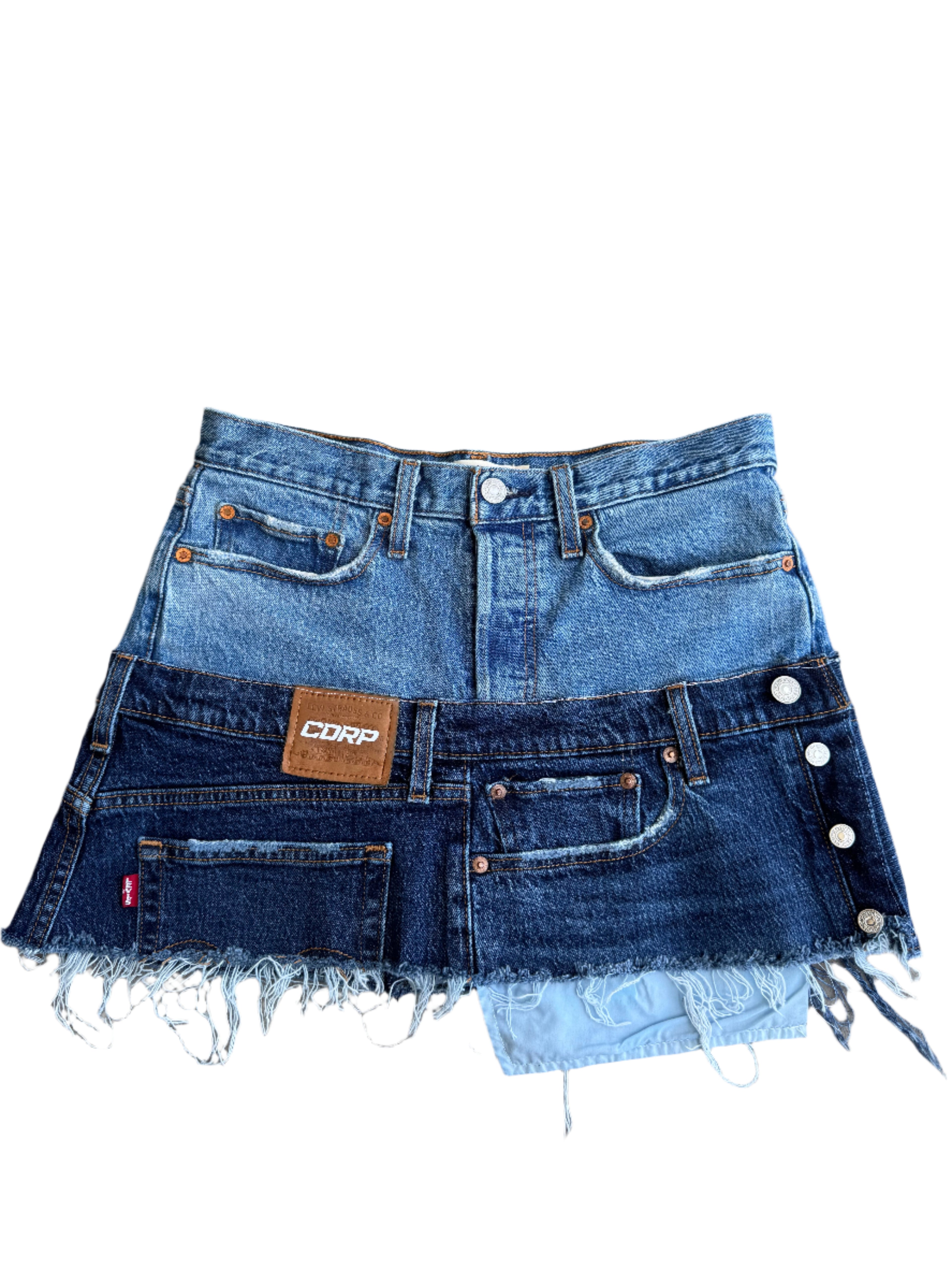 Stacked denim jean skirt on a white surface