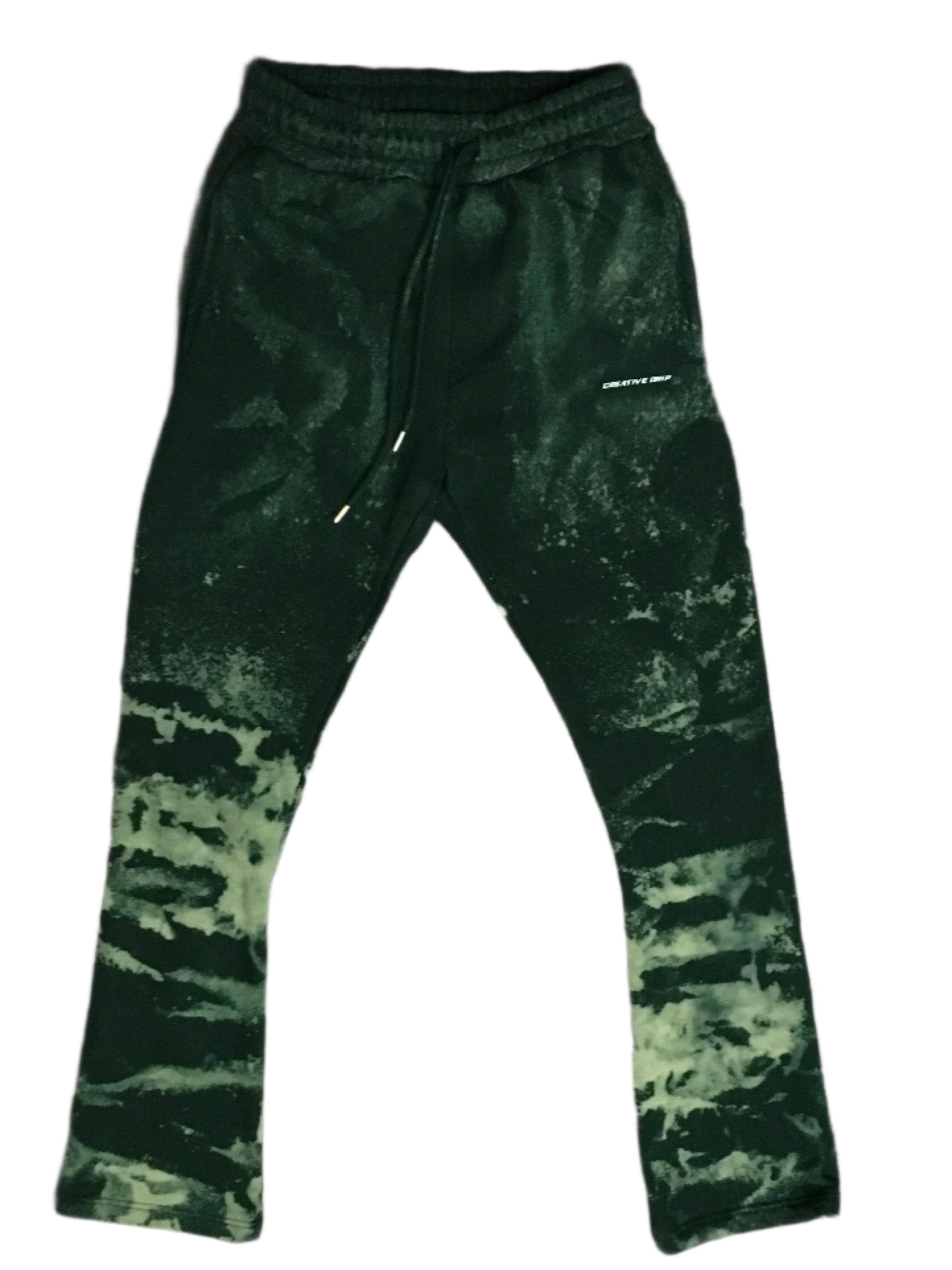 Green cotton sweats with a flare fit and acid wash detailing. Soft and comfortable, they offer a relaxed style with a unique, distressed look.