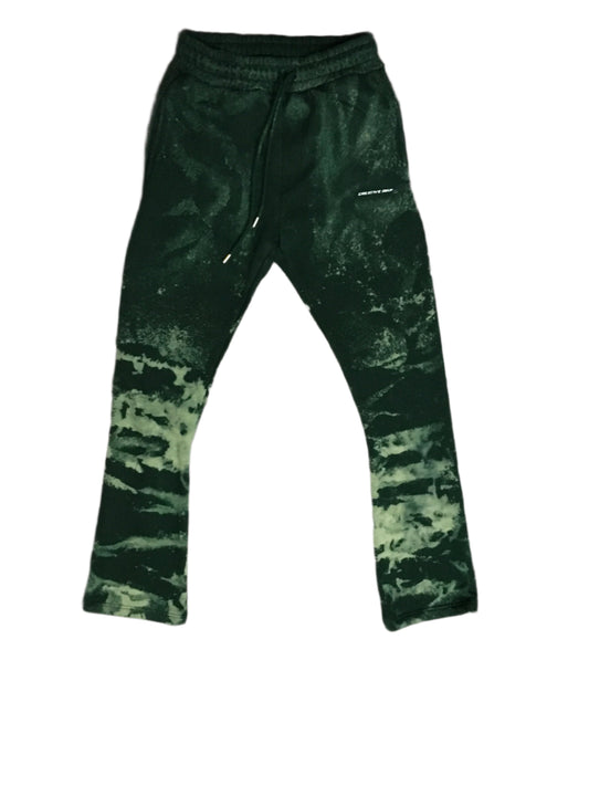 Green cotton sweats with a flare fit and acid wash detailing. Soft and comfortable, they offer a relaxed style with a unique, distressed look.