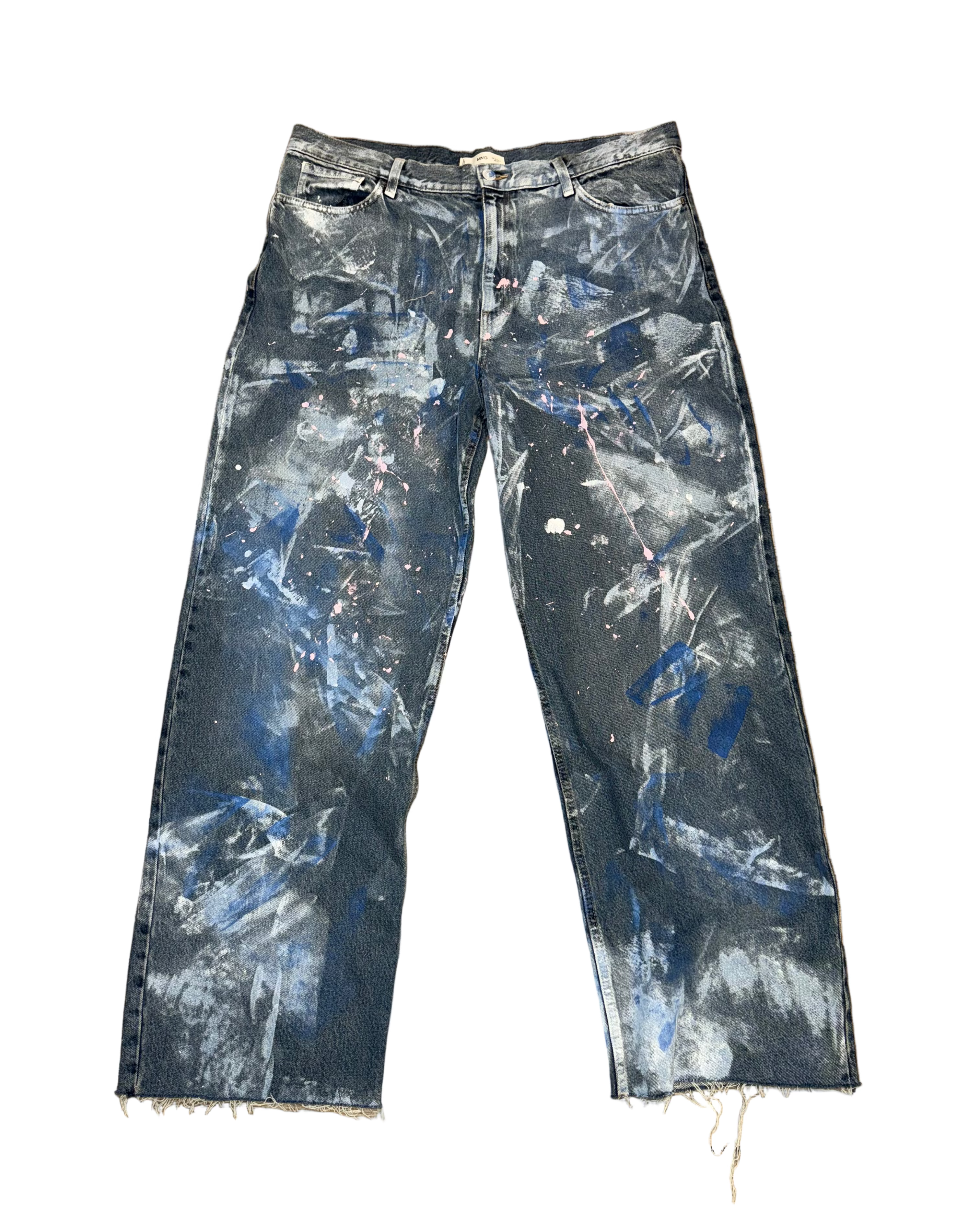 Distressed blue jeans with white paint splashes on a white background
